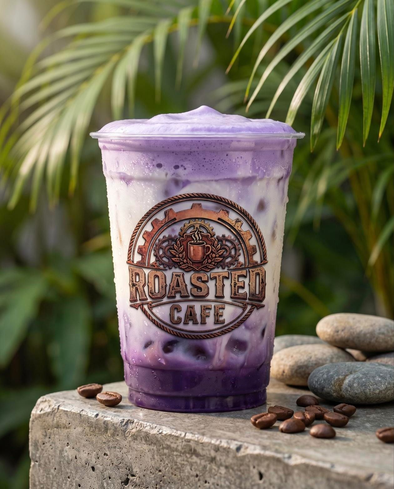 Iced ube latte with purple cold foam in a clear Roasted Cafe takeaway cup, Canggu